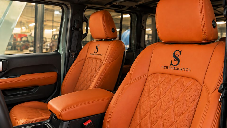 Interior: orange leather seats with the brand S